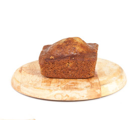 Homemade banana bread sliced on white background