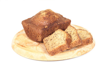 Homemade banana bread sliced on white background