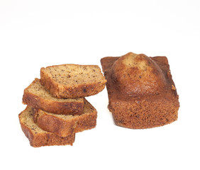 Homemade banana bread sliced on white background