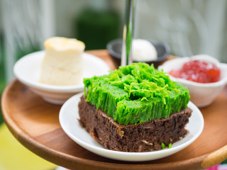 Brownie topped with green egg threads