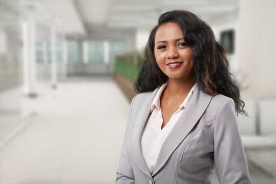 Portrait of young Malagasy business lady  smiling and looking at camera