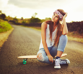 Woman with Skateboard © EpicStockMedia