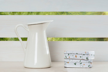 White shelf, jug and small boxes. Interior, Decor 