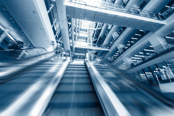 escalator with passengers motion blur