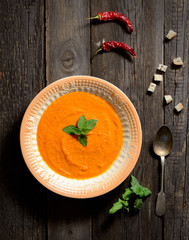 soup puree of carrots on a wooden background
