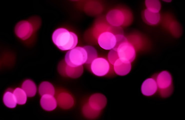 Pink bokeh on dark background