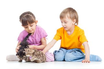 Fototapeta na wymiar happy children playing with kitten