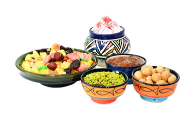 Various delicious ingredients for breakfast. Jam, dried fruits, nuts. Isolated on white background