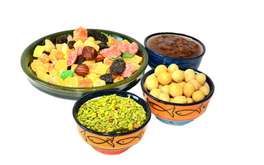 Various delicious ingredients for breakfast. Jam, dried fruits, nuts. Isolated on white background