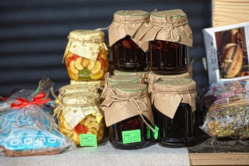 Homemade honey and jam in jar on fair market