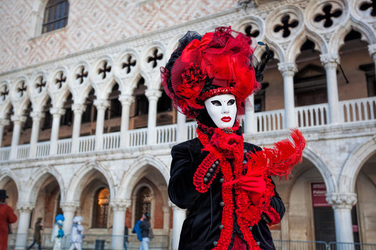 Fototapeta Carnival mask against Doge palace in Venice, Italy