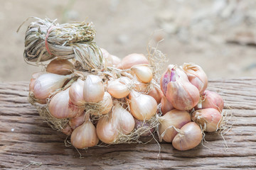 shallots on wooden table.