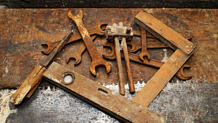 Old woodworking tools on dirty wooden table