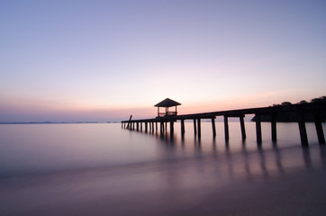 Fototapeta na wymiar wooden landing with pavilion in the sea.