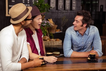 Smiling friends talking