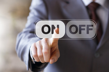 Businessman pressing ON OFF web button