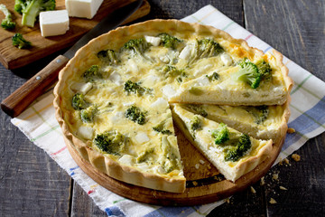 Open pie quiche Lauren with broccoli and cheese, selective focus