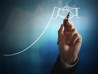Businessman drawing graphics  growing graph