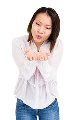 Young woman blowing a kiss