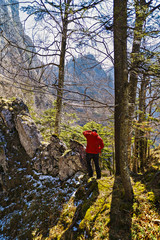 Obraz premium Man hiker enjoying the view on a mountain trail