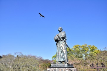 The eagle and statue of Sakamoto Ryoma in Kazagashira Park on April 6, 2014 at Nagasaki, Japan. Sakamoto Ryoma is a prominent figure in Japan.
