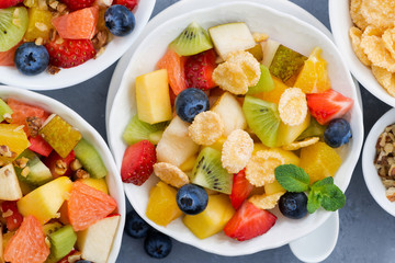 healthy breakfast with fruit salad, top view closeup