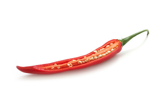 A Sliced Hot Chili Pepper Showing The Seeds. Isolated On White.