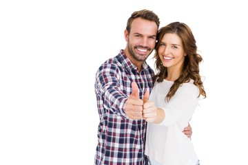 Happy young couple putting thumbs up
