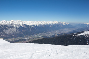 Skiing At Axamer Lizum With View To Innsbruck In Tyrol Austria