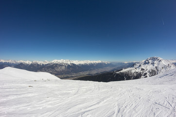 Skiing At Axamer Lizum With View To Innsbruck In Tyrol Austria