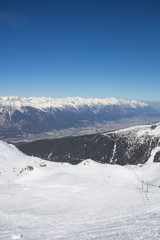 Fototapeta na wymiar Skiing At Axamer Lizum With View To Innsbruck In Tyrol Austria