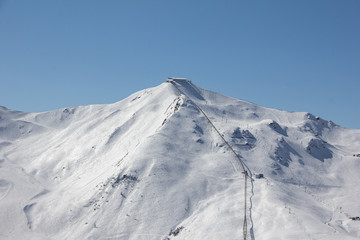 Fototapeta na wymiar Skiing At Axamer Lizum With View To Hoadlhaus 2.340m In Tyrol Austria