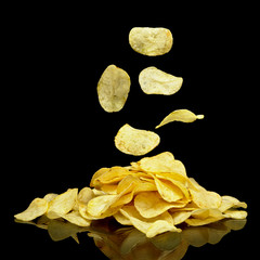Heap of potato chips with falling chips