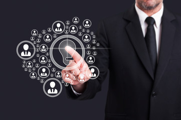 Business manager touching virtual screen with social contacts ic