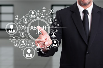 Business man in suit working with virtual networked community ic