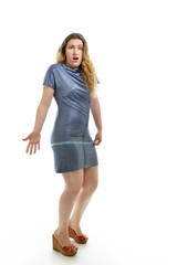 Fototapeta premium Overweight unhappy young woman measuring her belly over white ba