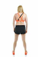 Fototapeta premium Overweight young woman, full length portrait, back view, over wh