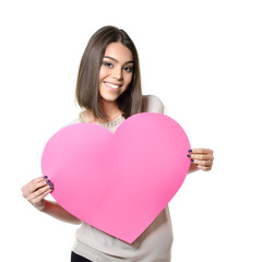 Obraz na płótnie Canvas Portrait of attractive happy smiling teen girl with pink heart,