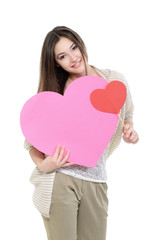 Portrait of attractive happy smiling teen girl with pink heart,