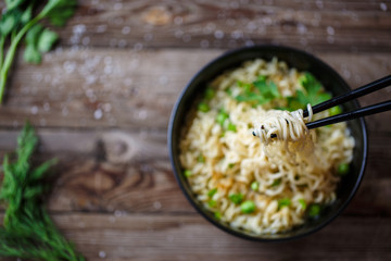 Chow Mein: fried noodles with chicken and vegetables close-up. horizontal view from above