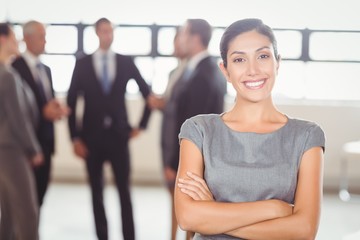 Attractive businesswoman smiling at camera