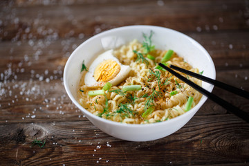 Asian noodles with fresh green onion and boiled egg