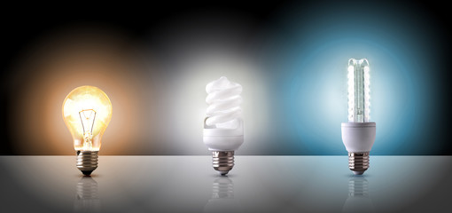 Comparison between various types of light bulb on black backgrou