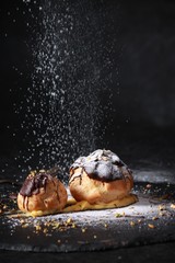 Profiteroles with cream,chiocolate and pistachios