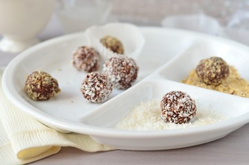 Homemade chocolate truffles with walnuts, almonds and coconut