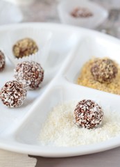 Homemade chocolate truffles with walnuts, almonds and coconut