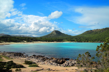 Fototapeta na wymiar Majorca, Cala Agulla, a rocky and sandy beach with emerald water