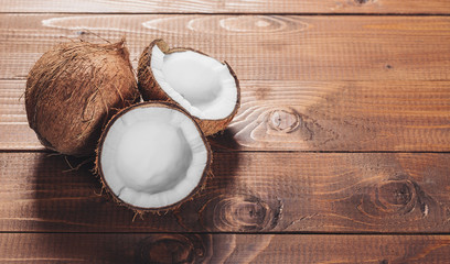 Coconut on wooden background © Ievgenii Meyer