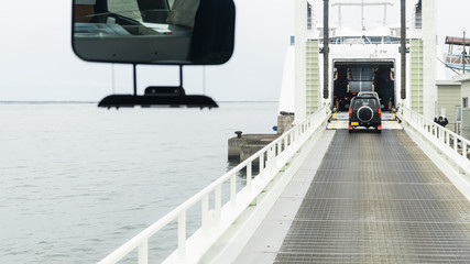 Cars driving inside Kumamoto Ferry , Japan
