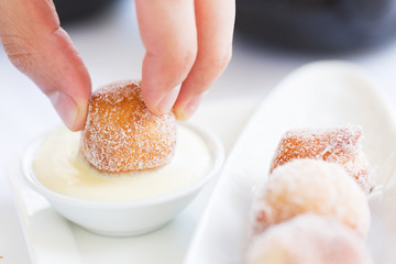 fresh beignets with sauce